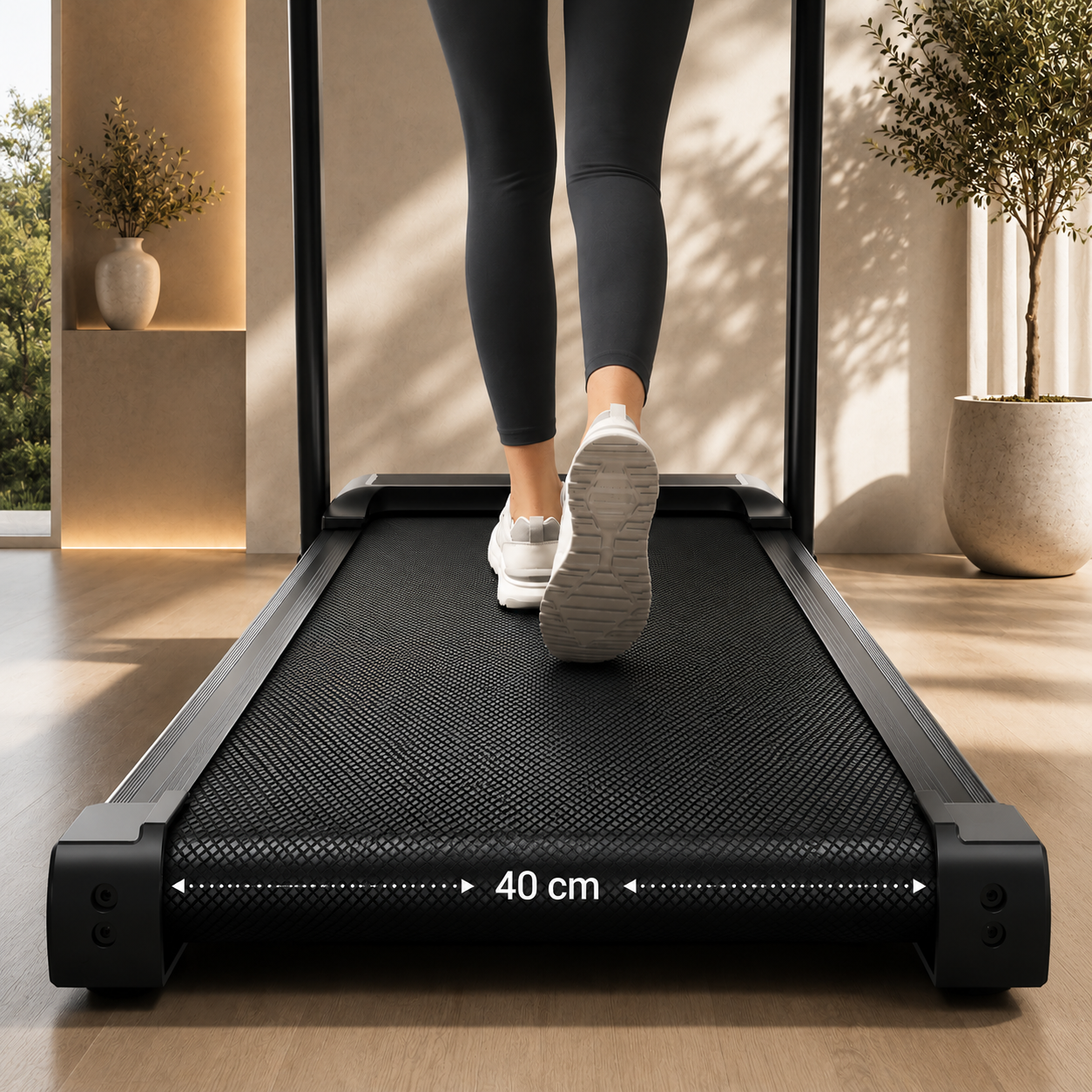 Tapis de marche 40 cm wide with person walking on it in a modern room.