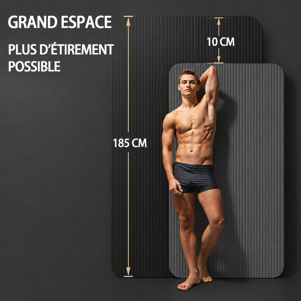 A fit man stands next to a large, ribbed grey gym mat measuring 185 cm in height.