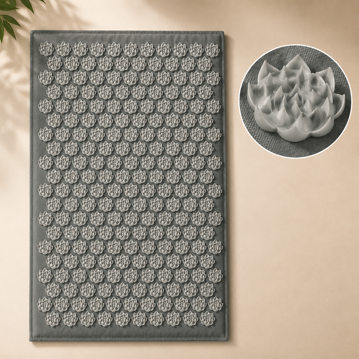 Gray acupressure mat with a flower-shaped spike pattern and a close-up of one spike.