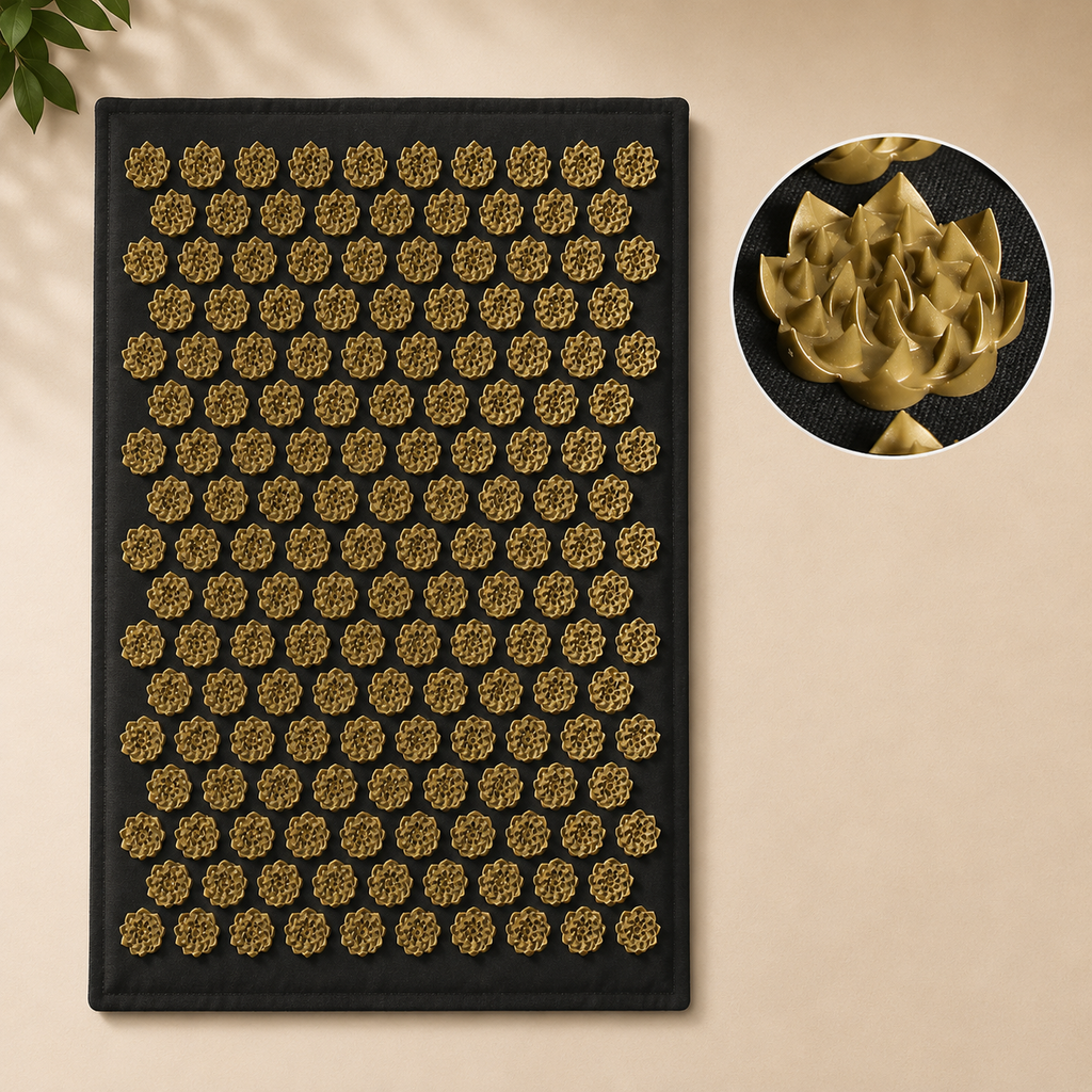 Acupressure mat with hundreds of golden lotus-shaped acupressure points on a black fabric base.
