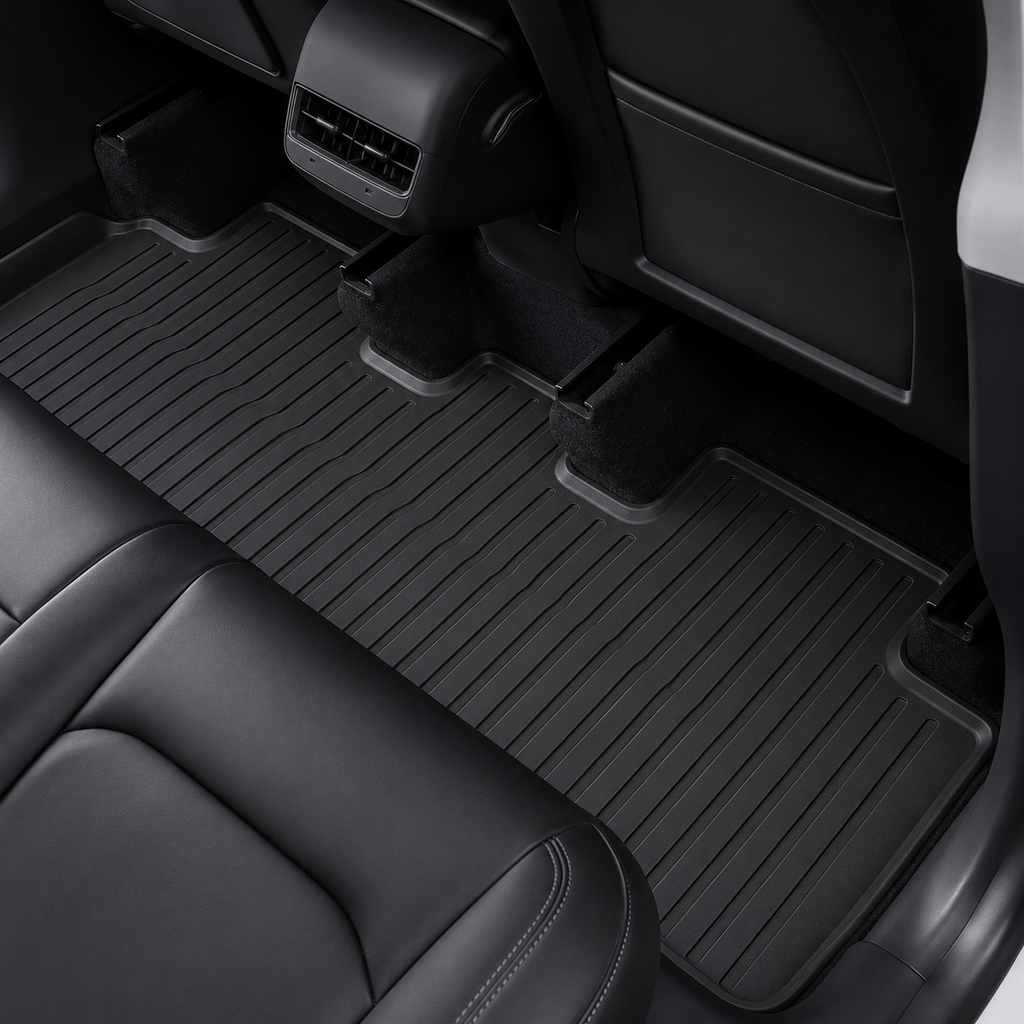 Black rubber floor mats for the rear seats of a Tesla Model 3 Highland.