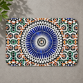 Rectangular Berber rug with intricate geometric blue, green, and orange mosaic pattern.