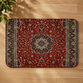 Red Moroccan Berber rug with intricate floral patterns and a central medallion on a wooden floor.