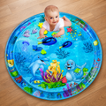 Baby lying on a blue inflatable water play mat with sea creatures.