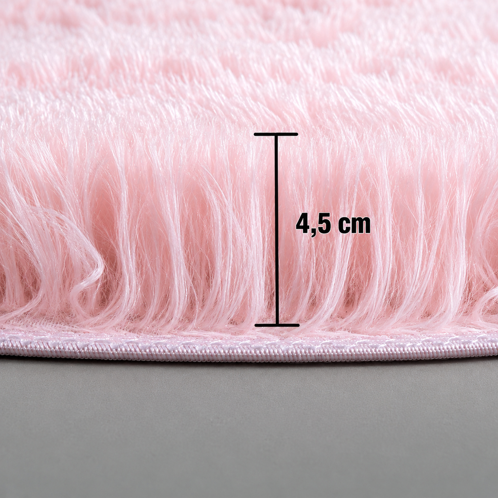 Close-up of a plush pink round rug showing a pile height of 4.5 cm.