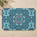 Colorful Berber rug with intricate geometric patterns in blue and teal.