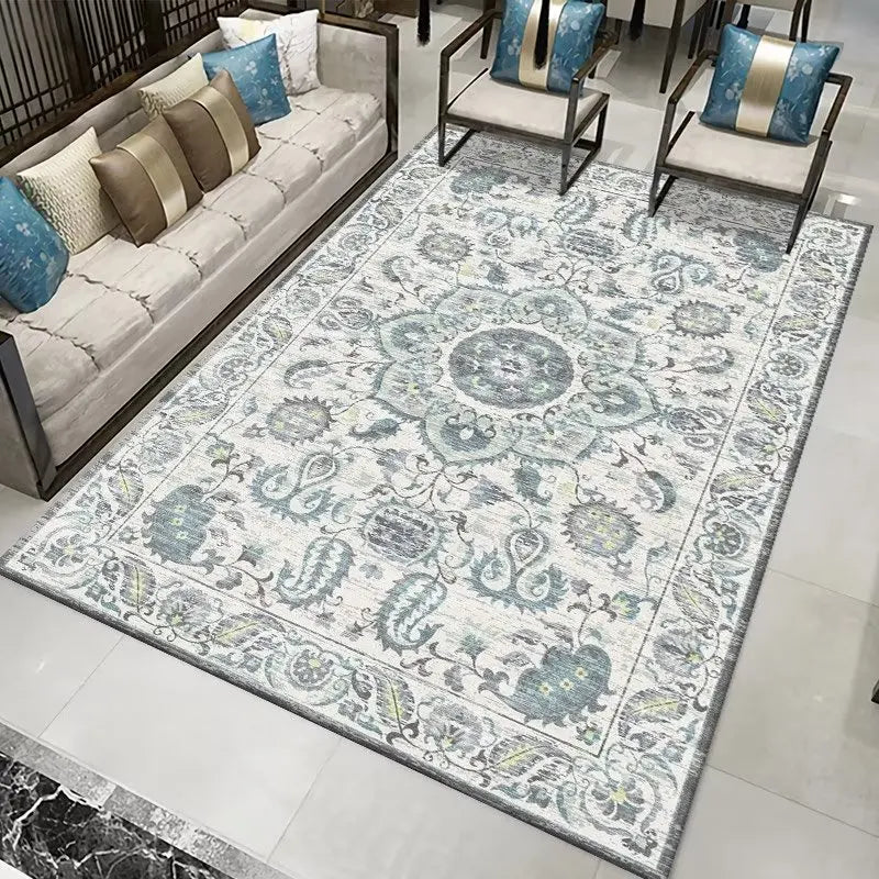 Traditional Persian-style area rug with intricate floral and paisley patterns in blue, grey, and cream.