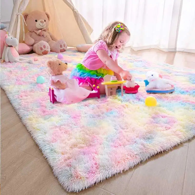 Fluffy rainbow tie-dye rug in a child's bedroom with a girl playing.