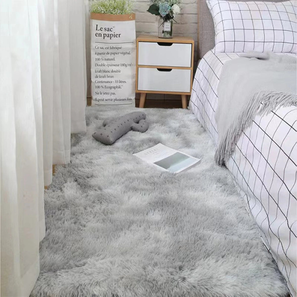 Plush grey bedroom rug with soft shag texture, complementing a modern interior design.