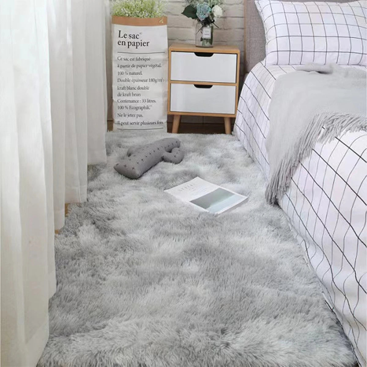Plush grey bedroom rug with soft shag texture, complementing a modern interior design.