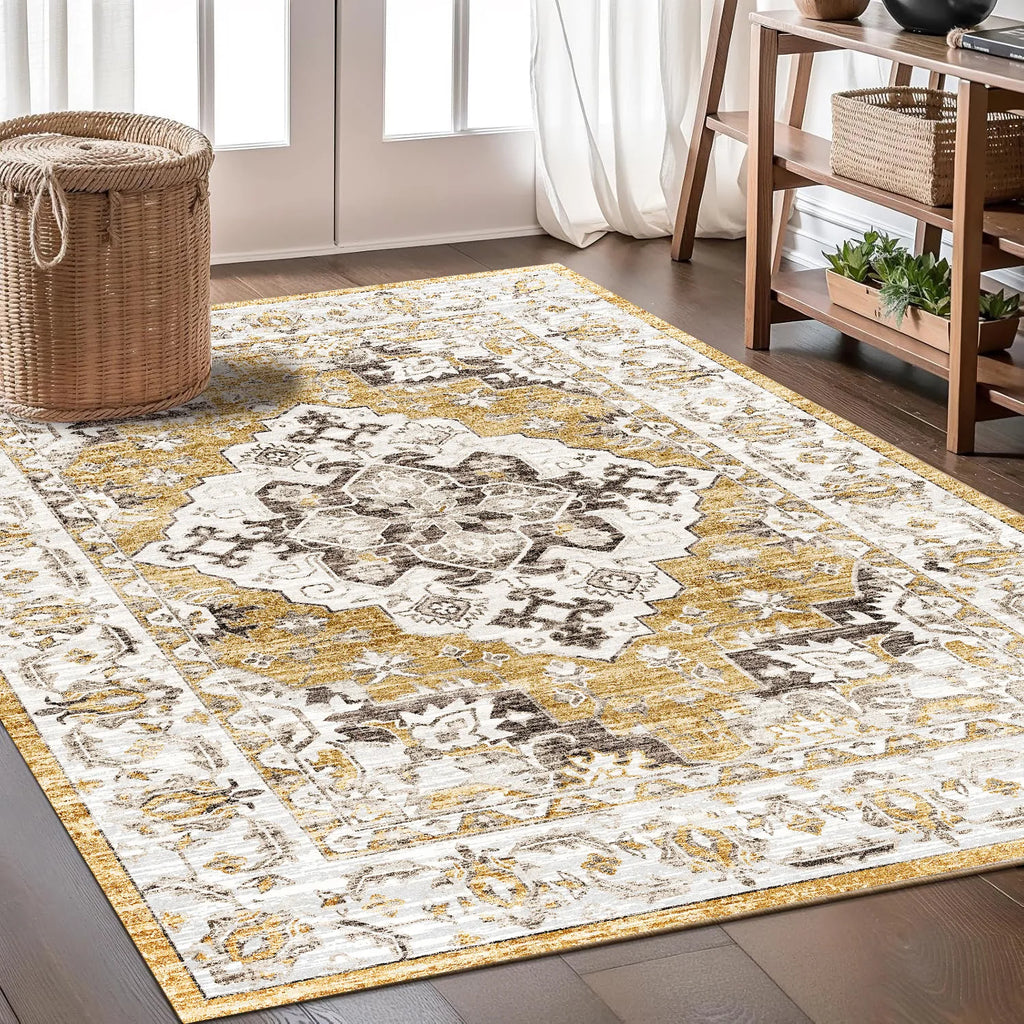 Tapis style persan with a distressed gold and white medallion design on a dark wooden floor.