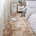 Plush beige bedroom rug with a soft, shaggy texture in a cozy bedroom setting.