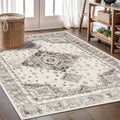 Tapis persan with intricate grey and cream traditional medallion pattern.