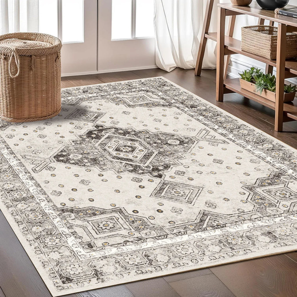 Cream and gray Persian-style area rug with intricate medallion and floral patterns.