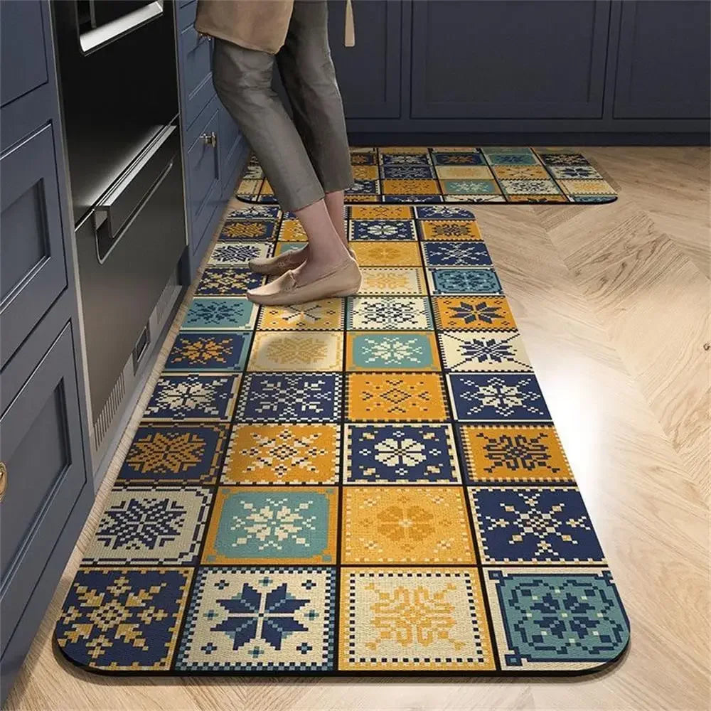 Colorful patterned kitchen mat with a mosaic tile design in yellow, blue, and white.