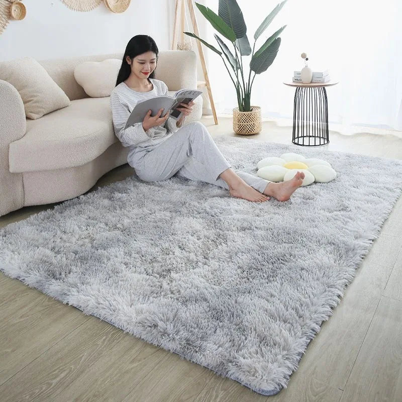 Fluffy grey bedroom rug with a soft texture, featuring a woman reading on a couch.