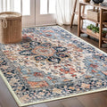 Cream and blue Persian-style area rug with distressed floral medallion pattern.