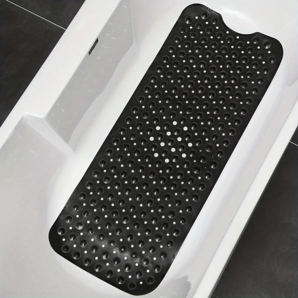 Black textured non-slip bath mat with suction cups inside a white bathtub.