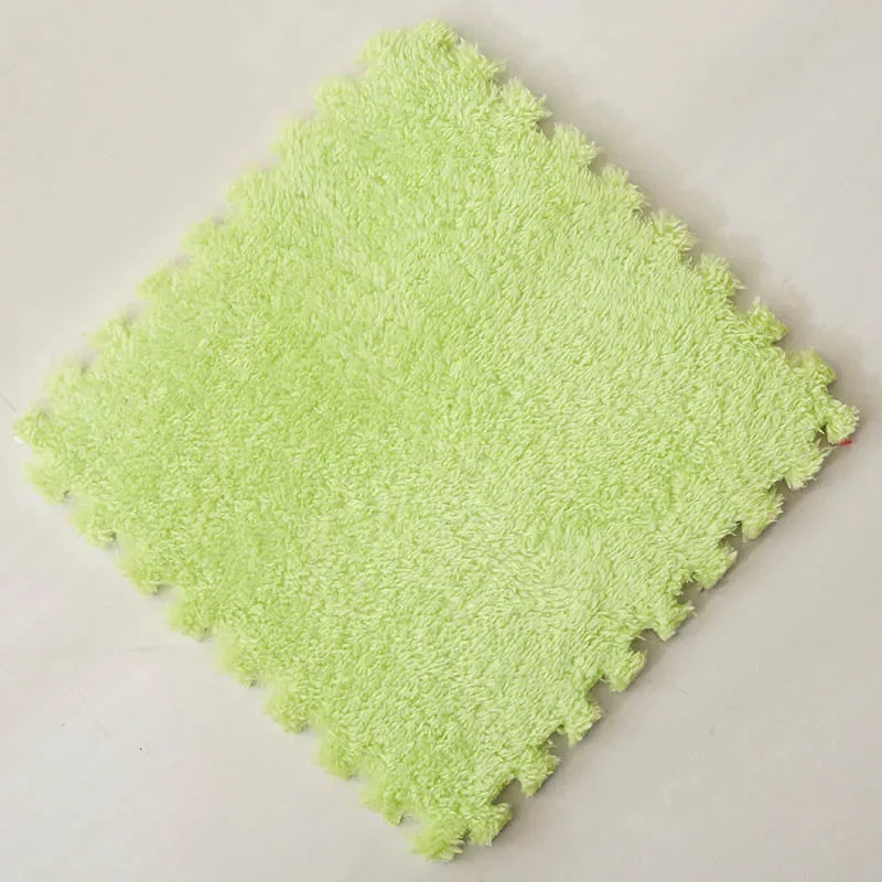 Soft, fuzzy, light green interlocking puzzle mat for flooring.