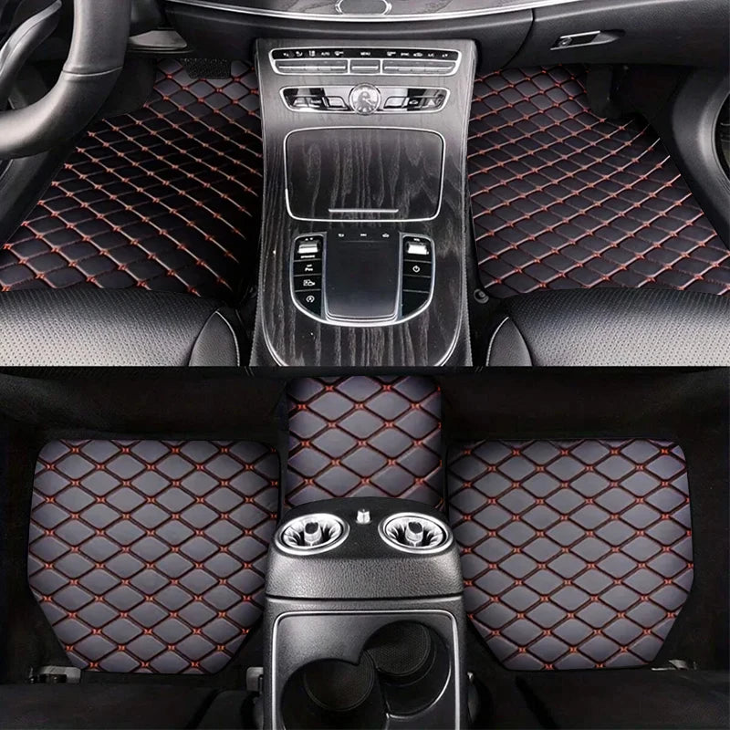 Black and red diamond-stitched car floor mats for a luxury vehicle interior.