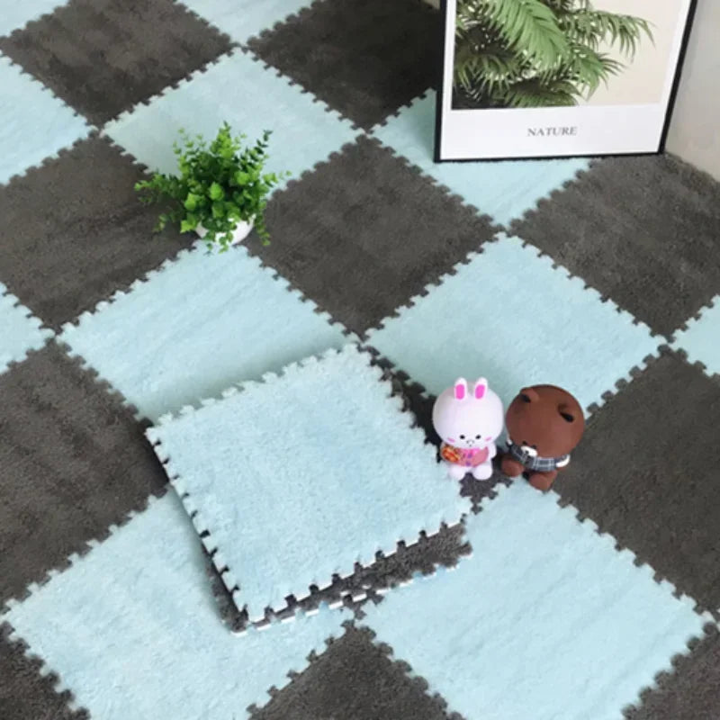 Soft, interlocking light blue and grey puzzle floor mats with plush texture, featuring cute toys.