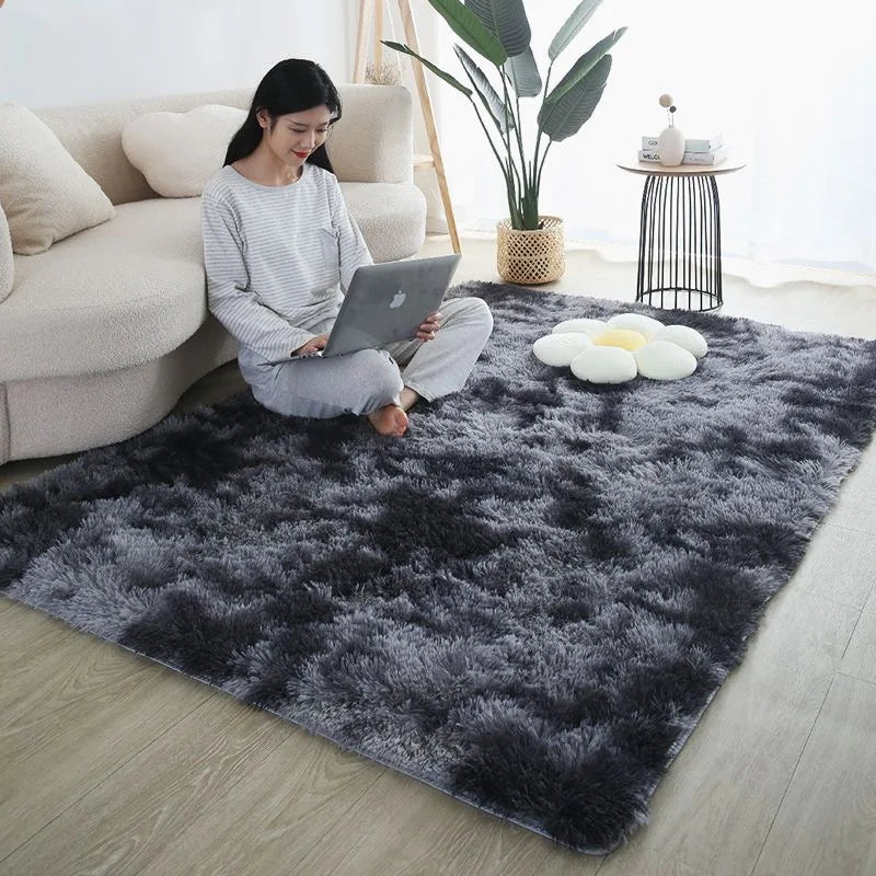 Plush grey ombre rug in a child's bedroom with a woman using a laptop.