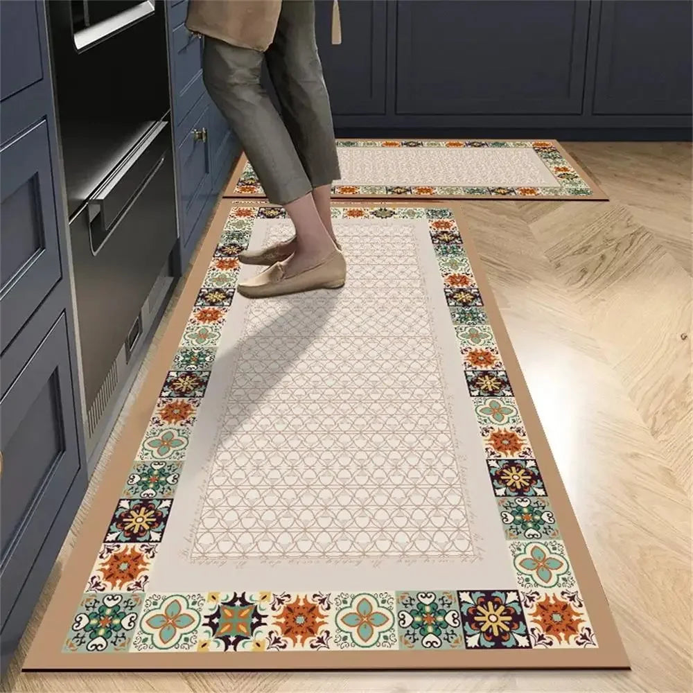 Tapis cuisine with a colorful mosaic border and a geometric pattern in the center.
