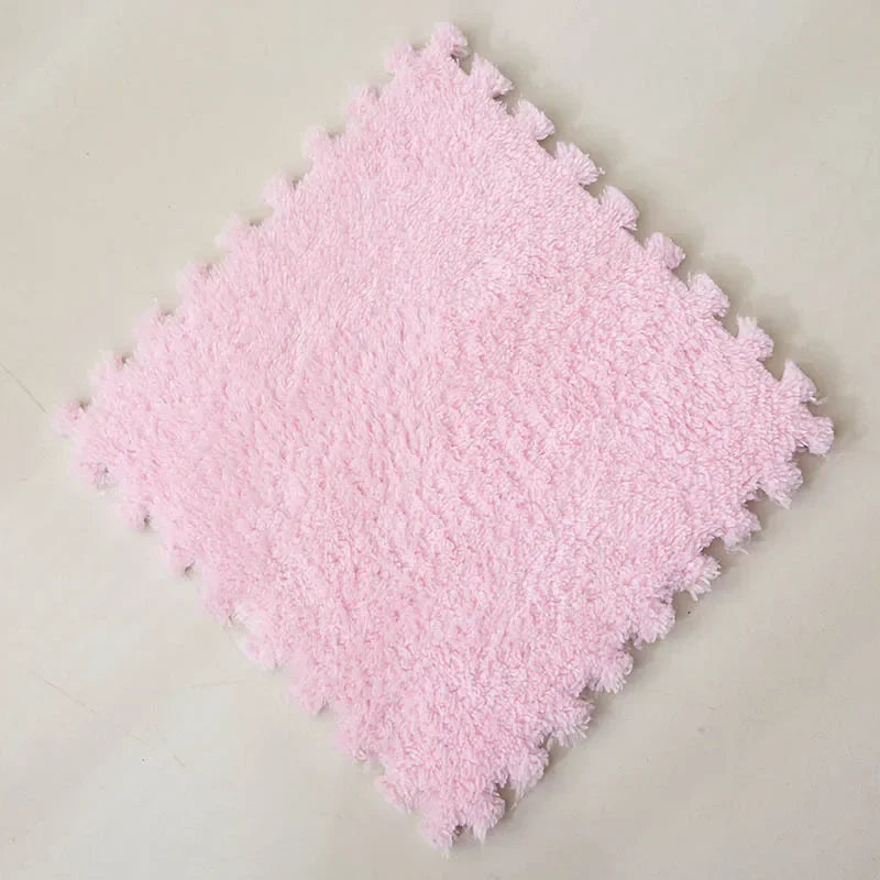 Soft pink fluffy interlocking puzzle mat, perfect for playrooms and nurseries.