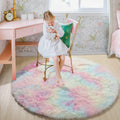 Fluffy round rug with pastel tie-dye colors in a child's bedroom.