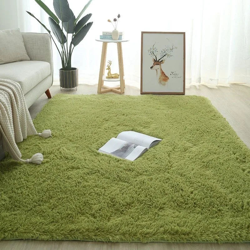 Soft green plush rug for a child's bedroom, with an open book on top.