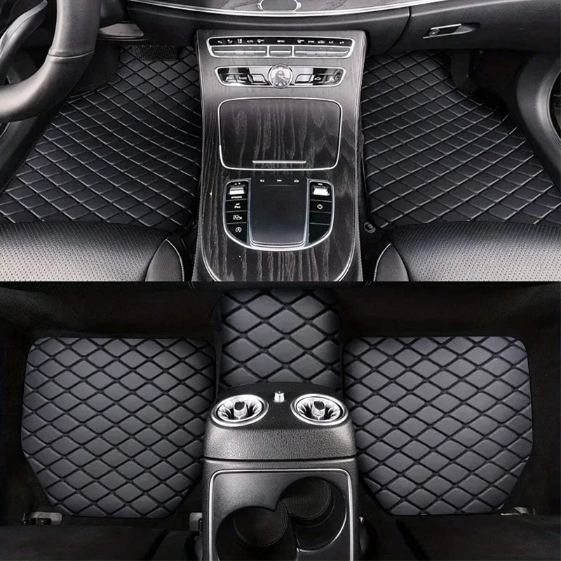 Black diamond-stitched car floor mats covering the front and rear footwells of a modern vehicle.