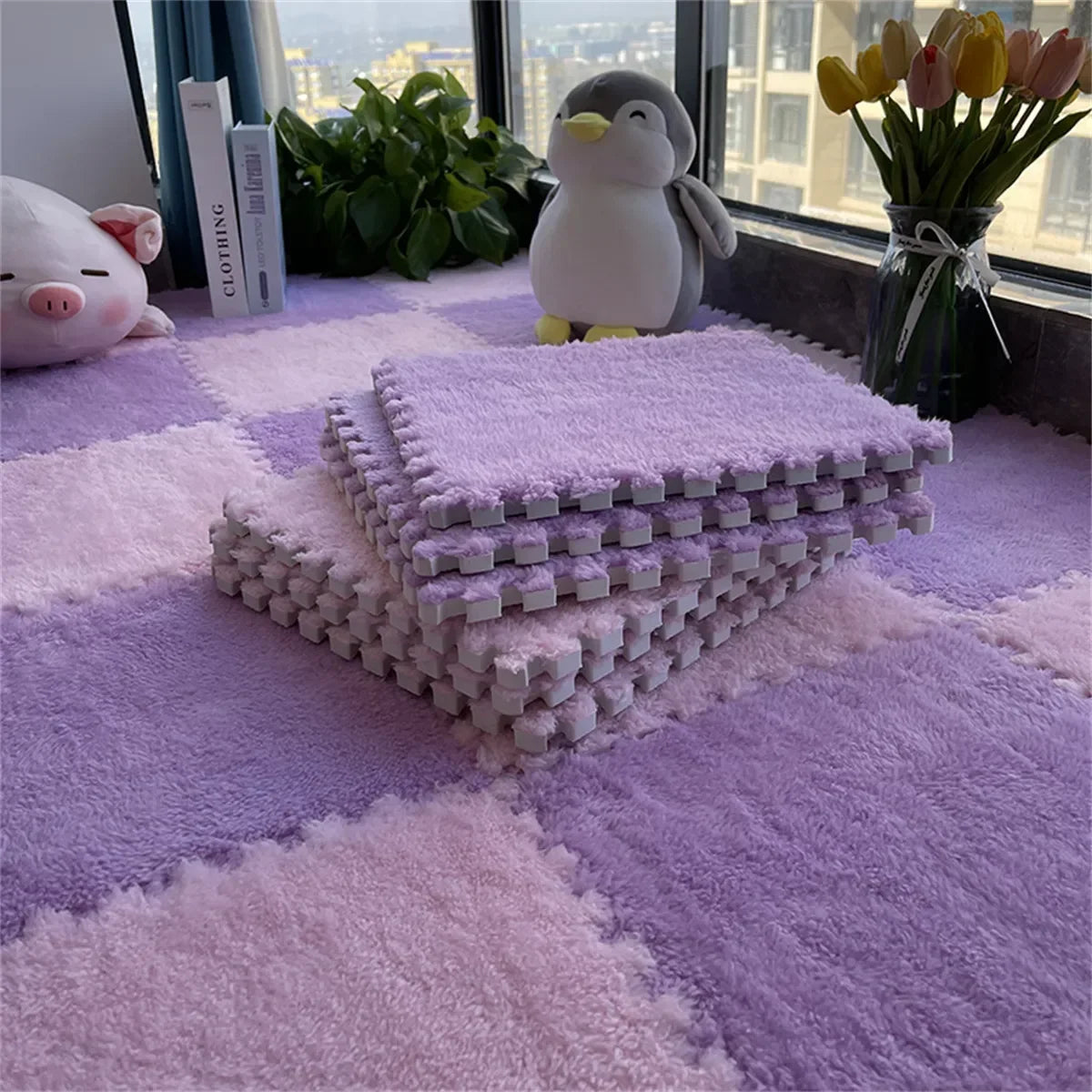 Stack of fluffy purple and pink interlocking floor puzzle mats for kids' rooms.