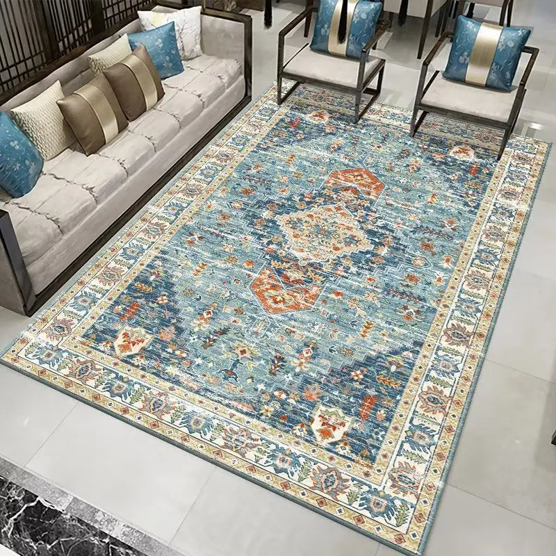 Persian-style area rug with intricate blue, orange, and cream floral patterns.