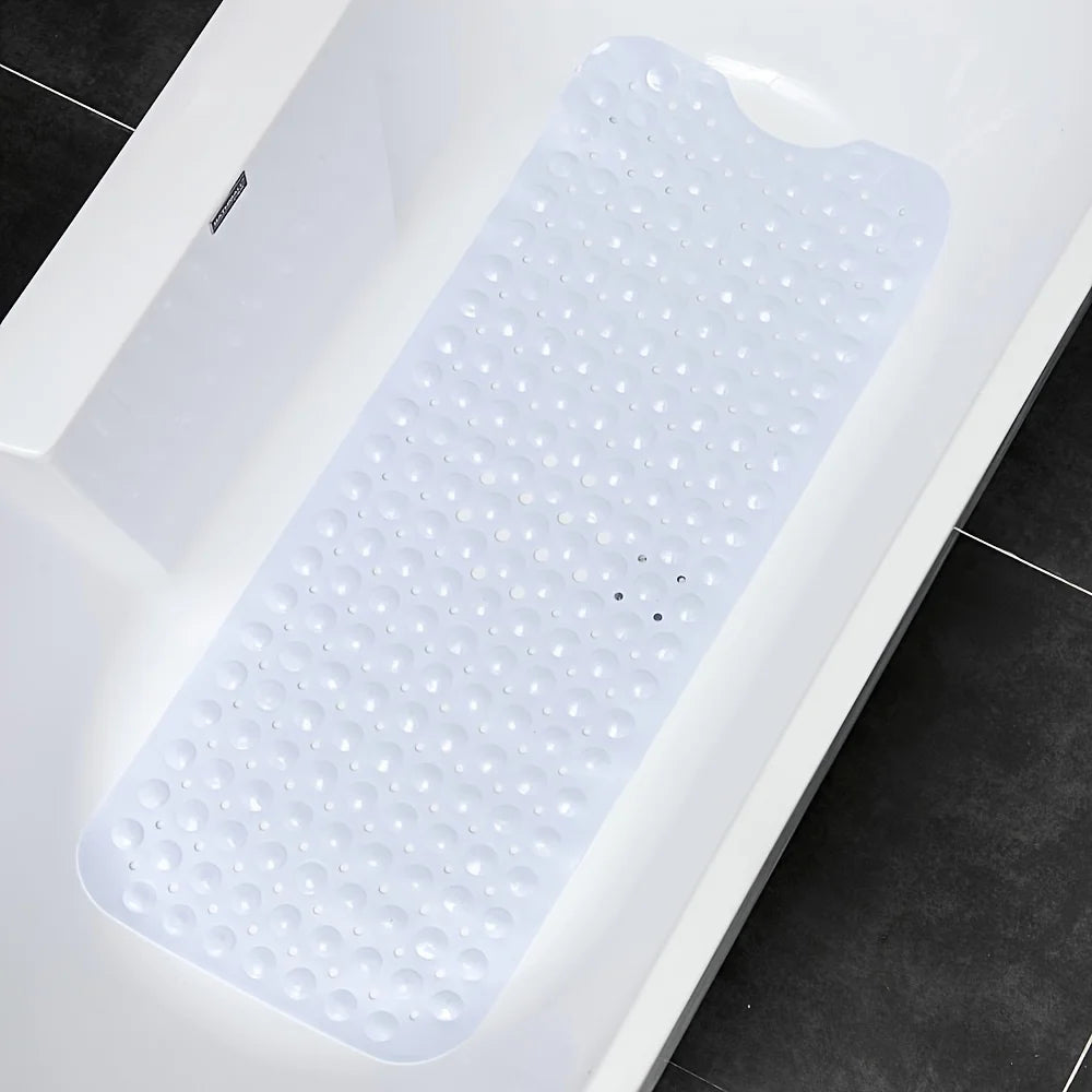 White textured non-slip bath mat with suction cups inside a clean white bathtub.
