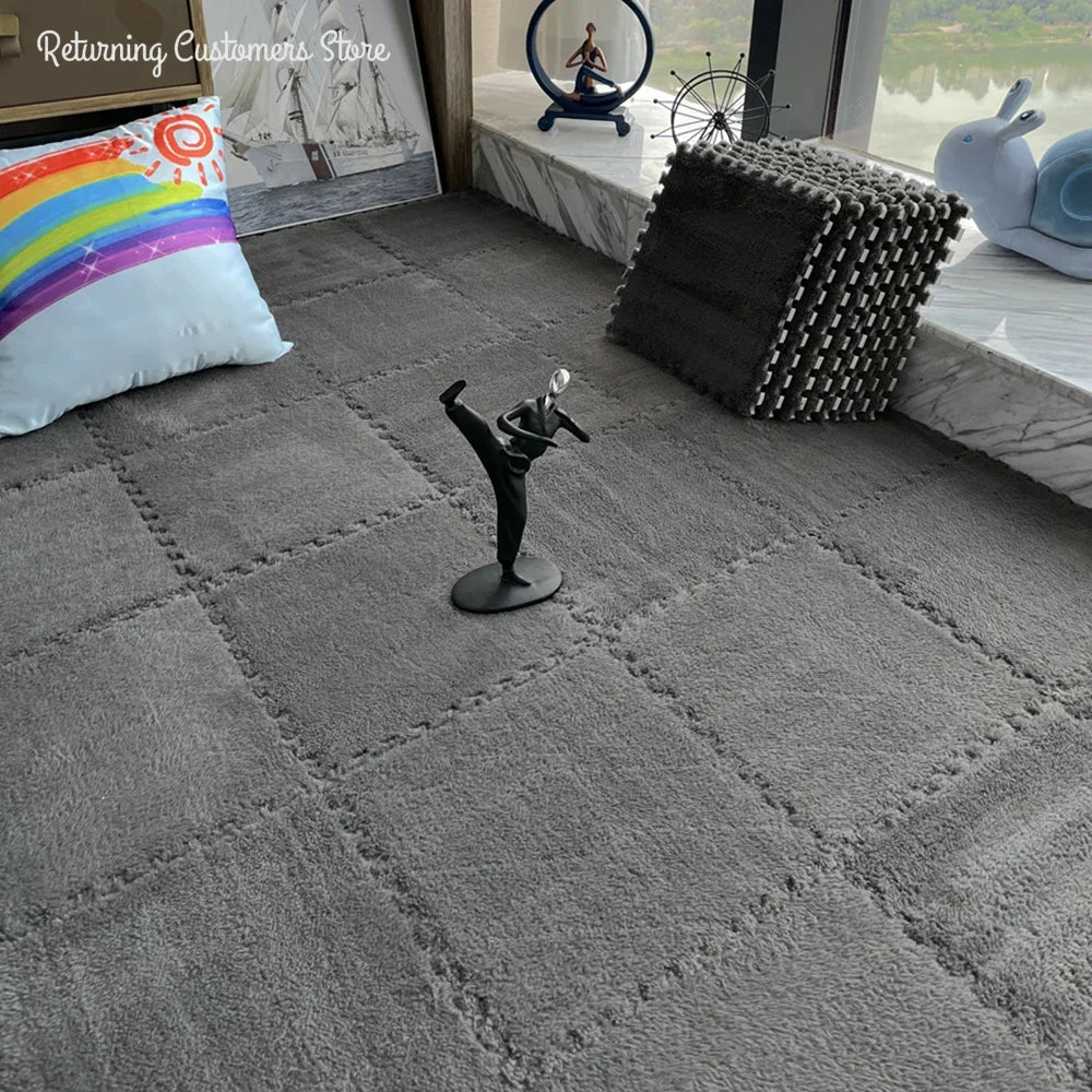 Gray interlocking plush puzzle mats arranged on the floor, showcasing their soft texture.