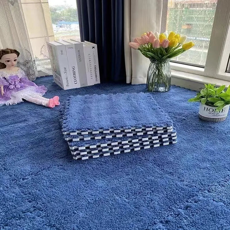 Stack of blue interlocking foam floor tiles for playrooms or nurseries.